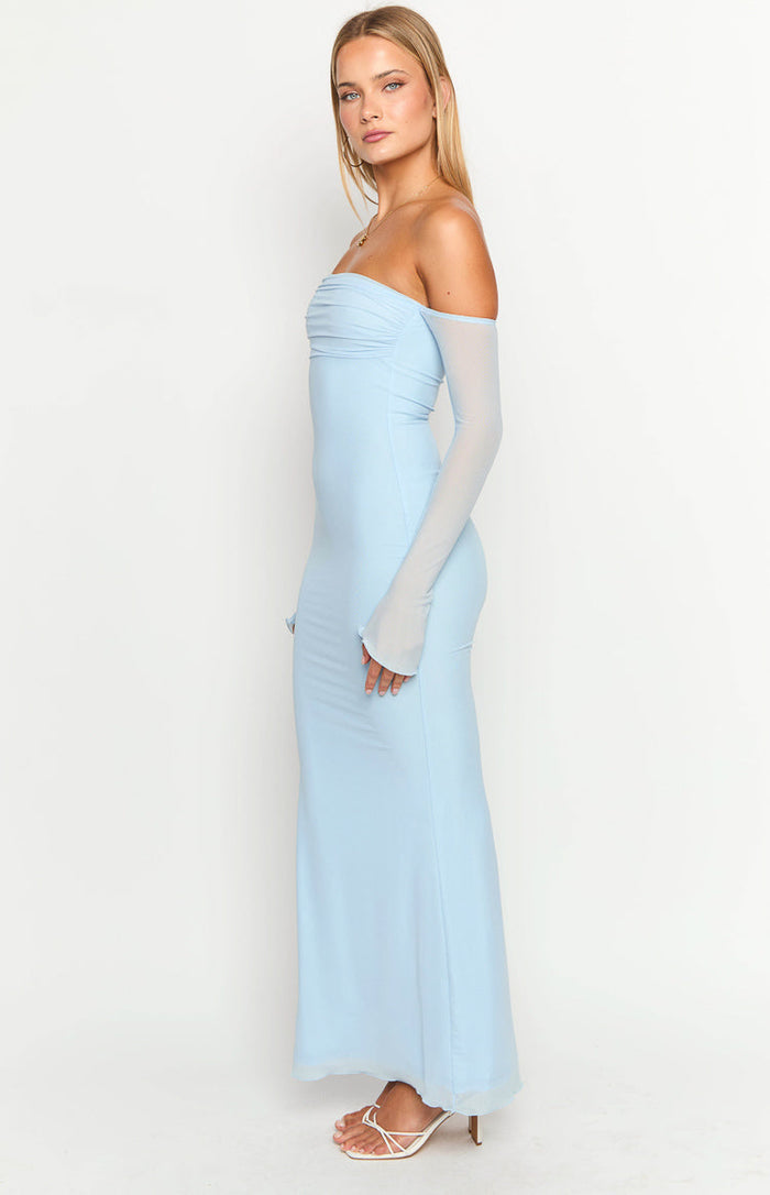 Side view of a light blue off-shoulder maxi dress with ruched bust and sheer long sleeves