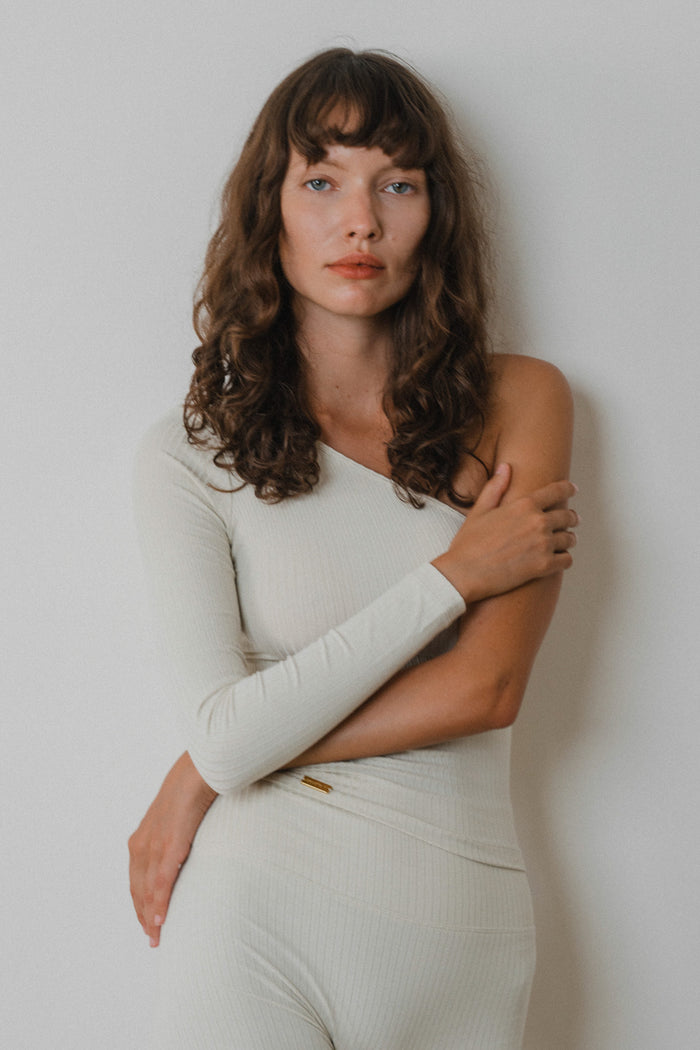 Studio K Rib One Shoulder Top in Ivory – sustainable, stylish, and comfortable yoga and lounge wear, available in multiple sizes.