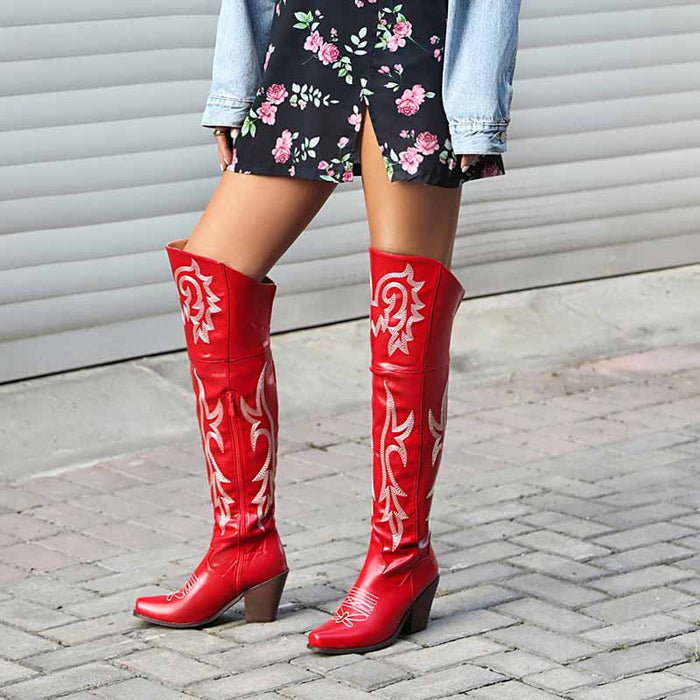 Red women's over the knee cowboy boots featuring intricate floral design and sturdy heels